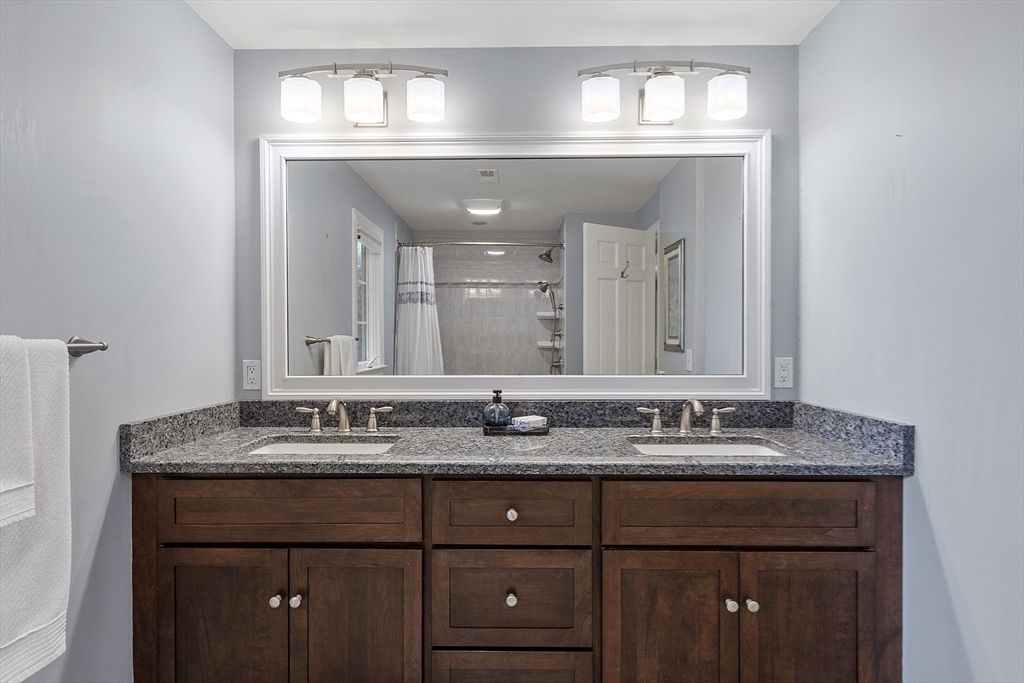 62 Waite Road Boxborough, MA 01719 - Photo 34 of 41 a bathroom with a granite countertop sink vanity and a mirror
