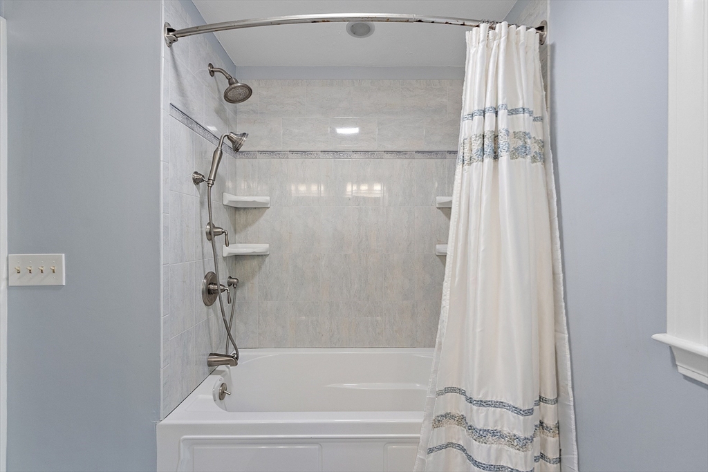 62 Waite Road Boxborough, MA 01719 - Photo 35 of 41 a bathroom with a shower and a bathtub