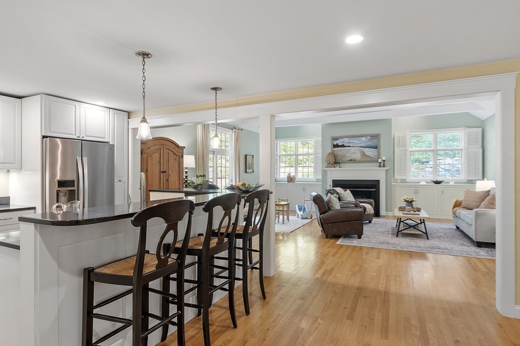 62 Waite Road Boxborough, MA 01719 - Photo 9 of 41 a living room with furniture a large window and wooden floor