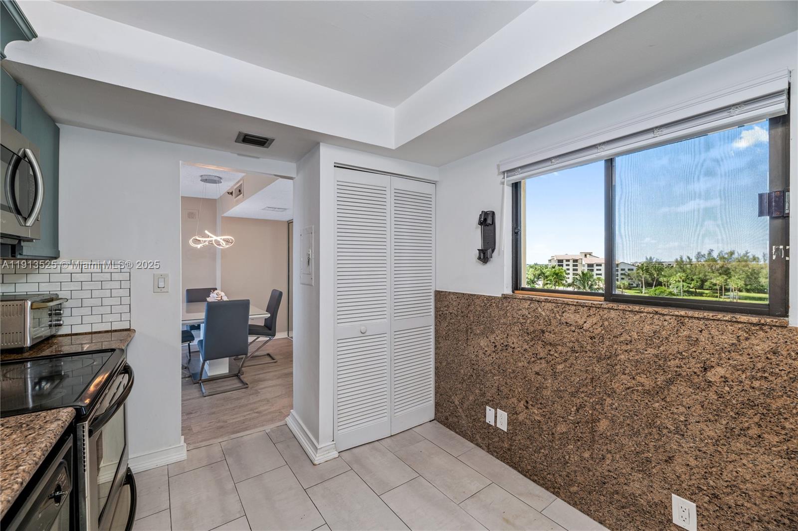 300 Ocean Trail Way, Unit 406 Jupiter, FL 33477 - Photo 11 of 19 a view of livingroom with furniture and windows