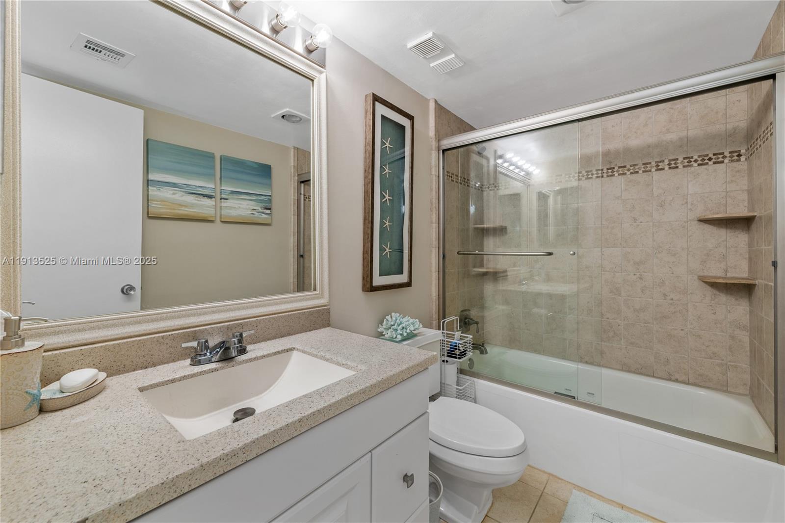 300 Ocean Trail Way, Unit 406 Jupiter, FL 33477 - Photo 19 of 19 a bathroom with a sink a toilet and shower