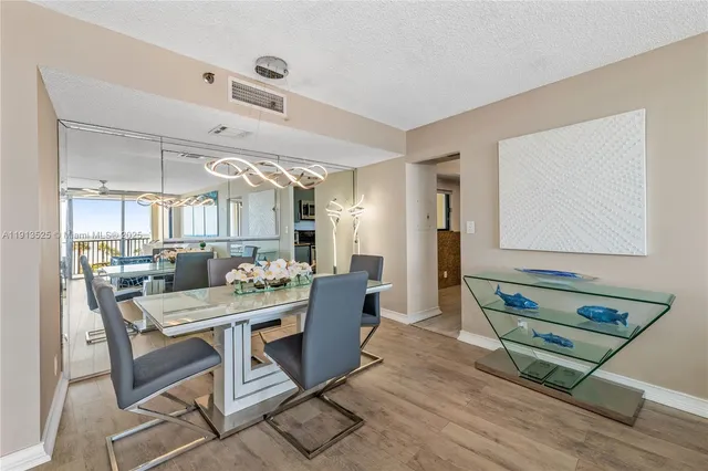 a living room with a table and chairs