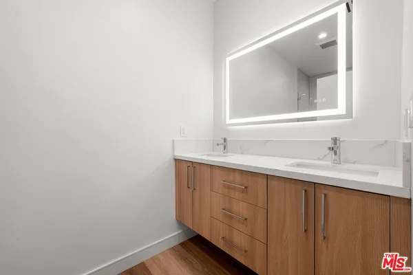 a bathroom with a shower a toilet and sink