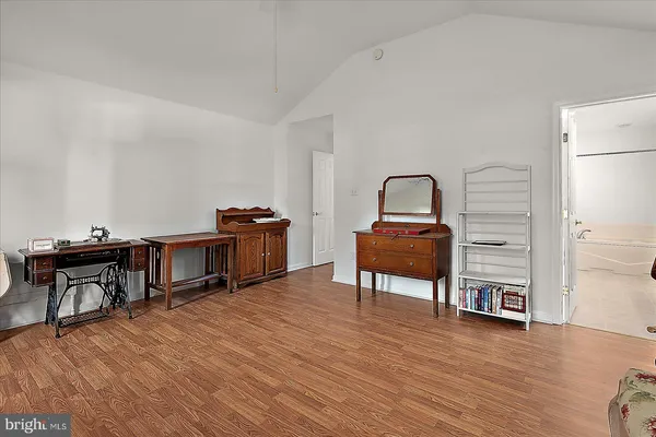 a bathroom with a tub sink double vanity granite tub and shower