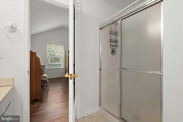 a white bath tub sitting next to a white sink