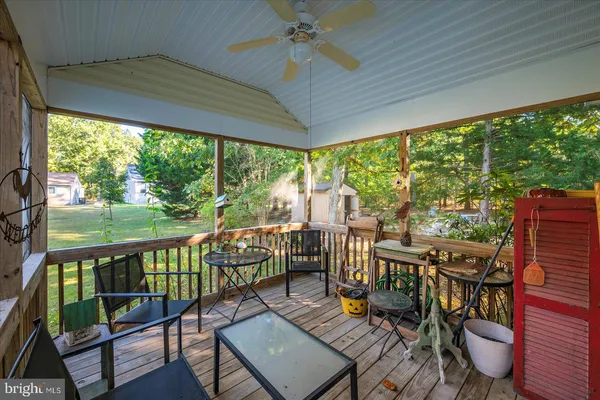 a view of a city from a balcony with furniture