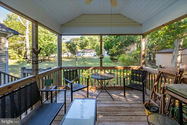 a view of a city from a balcony with furniture