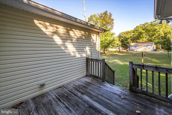 a view of a house with a yard porch and sitting area