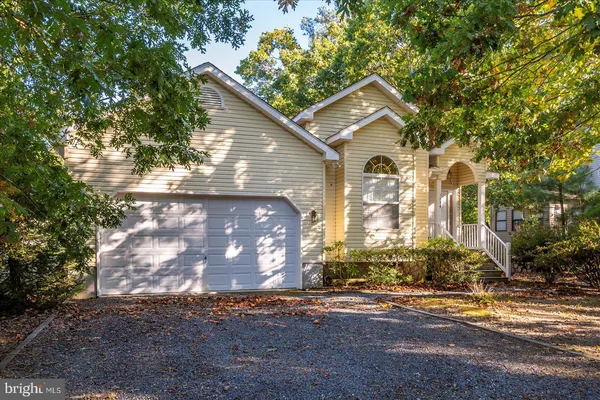 a view of a house with a tree