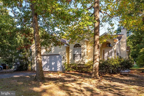 a view of a yard with wooden fence and floor