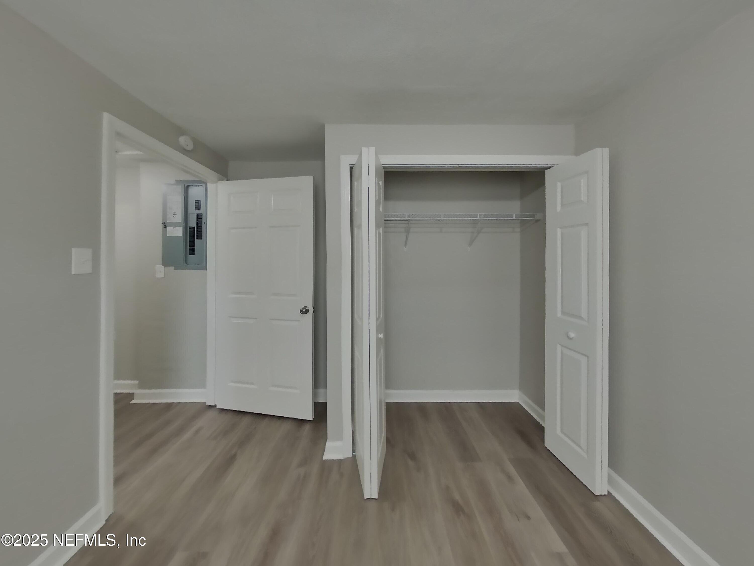 5807 Ricker Road Jacksonville, FL 32244 - Photo 6 of 13 a view of hallway with wooden floor