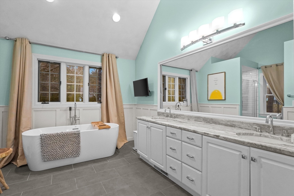 20 Barnside Road Boxford, MA 01921 - Photo 18 of 42 a bathroom with a tub double sink and a large mirror