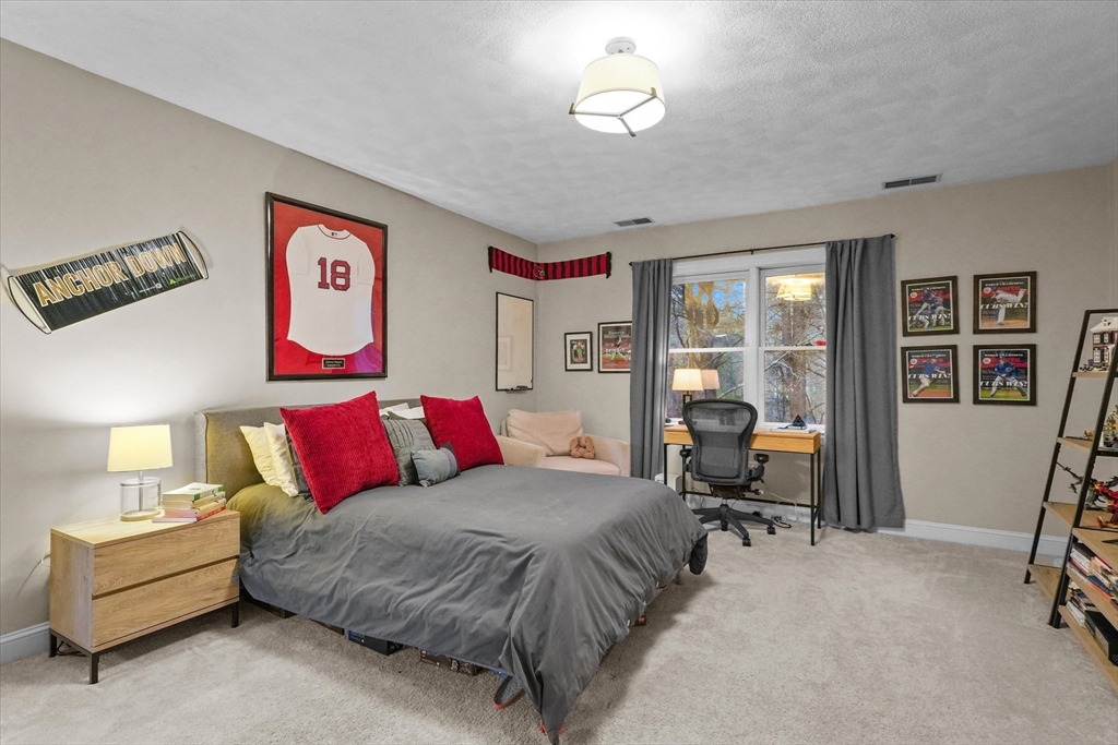 20 Barnside Road Boxford, MA 01921 - Photo 27 of 42 a bed room with a bed and a chair