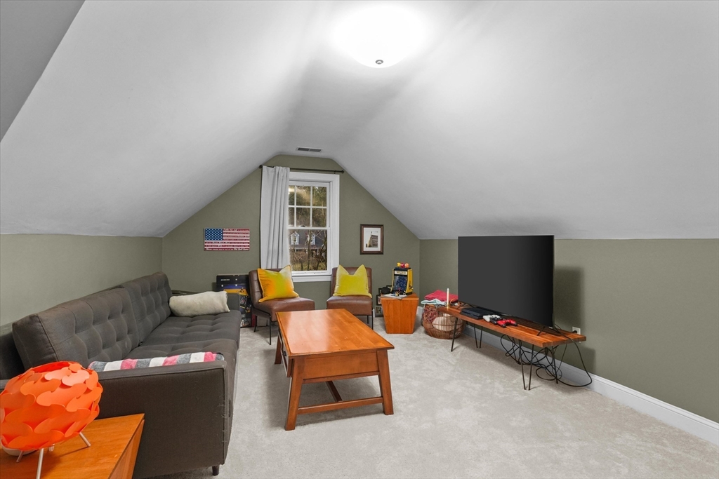 20 Barnside Road Boxford, MA 01921 - Photo 29 of 42 a living room with furniture and a flat screen tv