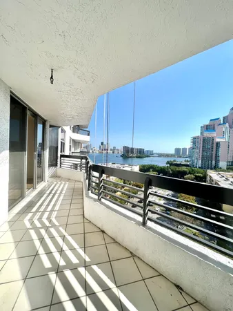 a view of a terrace with wooden floor and seating space