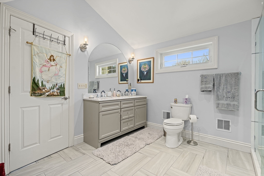 53 Linden Road Hampton Falls, NH 03844 - Photo 22 of 42 a bathroom with a toilet a sink and a mirror