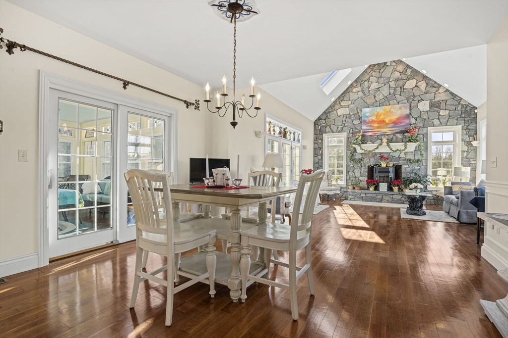 53 Linden Road Hampton Falls, NH 03844 - Photo 4 of 42 a view of a dining room with furniture wooden floor and chandelier
