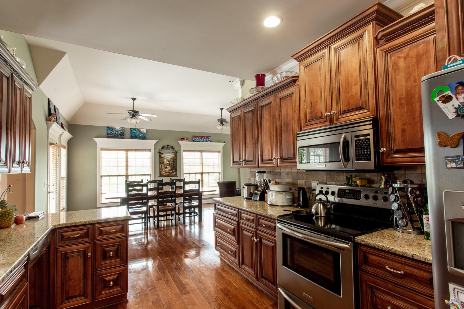 245 Dunaway Road Lebanon, TN 37090 - Photo 14 of 30 a kitchen with granite countertop a stove and cabinets