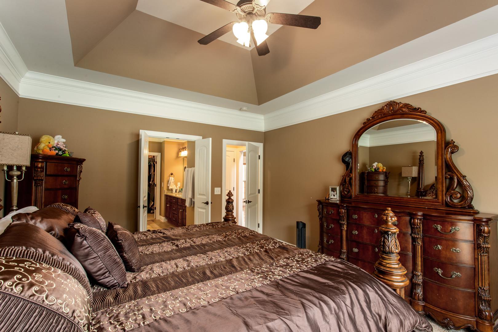 245 Dunaway Road Lebanon, TN 37090 - Photo 15 of 30 a bedroom with a bed and a chandelier
