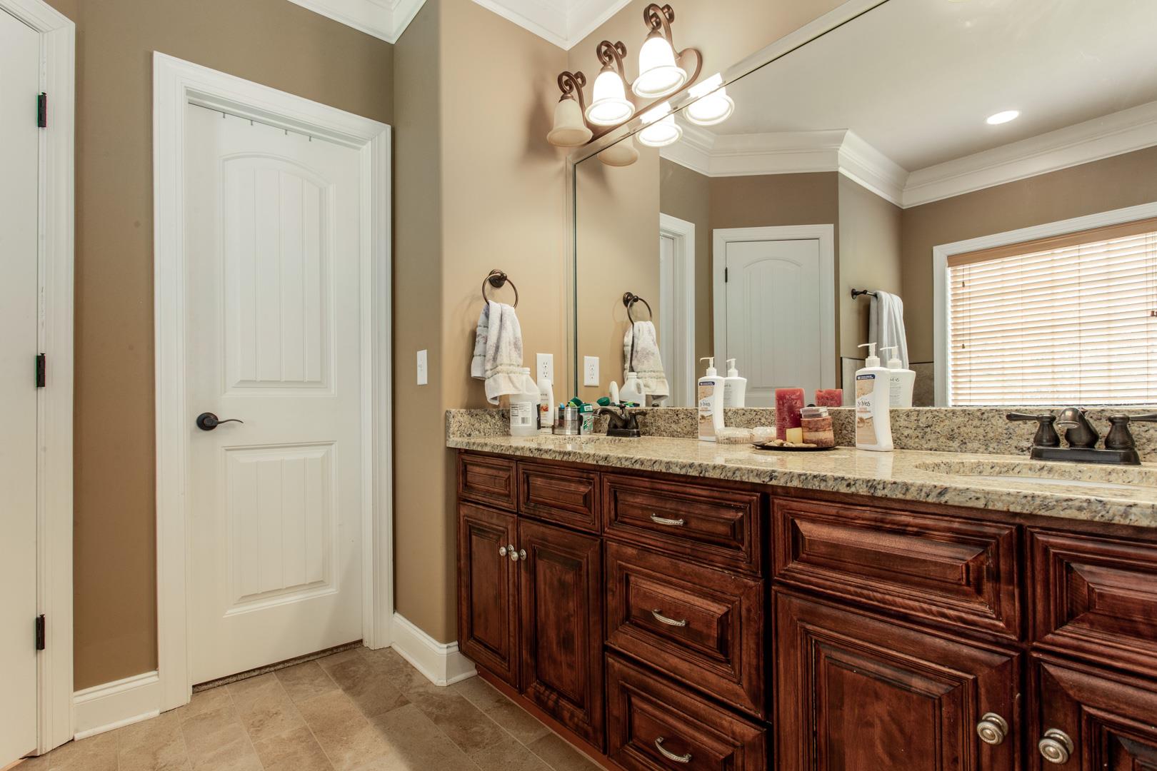 245 Dunaway Road Lebanon, TN 37090 - Photo 18 of 30 a bathroom with a granite countertop sink and a mirror