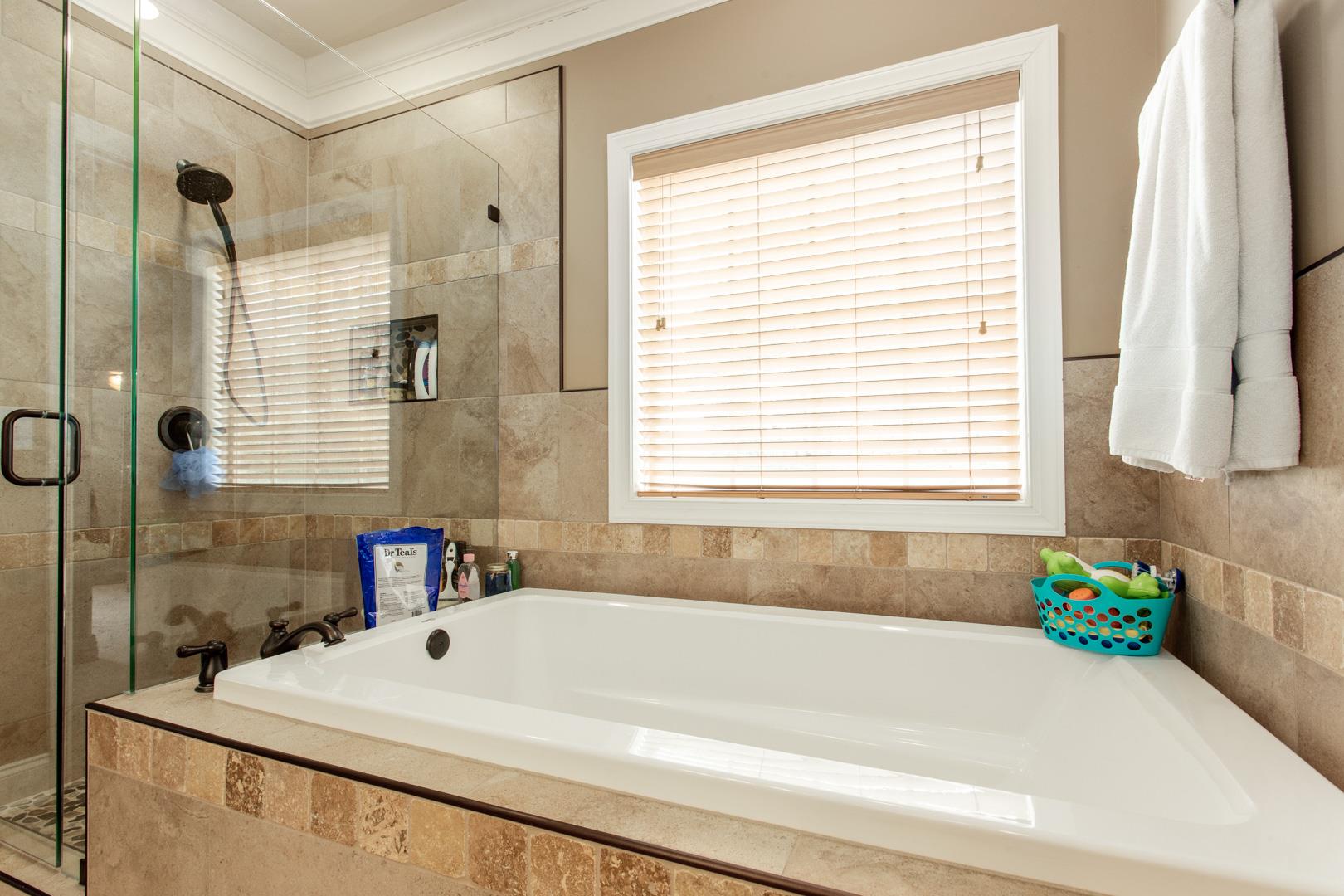 245 Dunaway Road Lebanon, TN 37090 - Photo 19 of 30 a bathroom with a sink and a bathtub next to a window