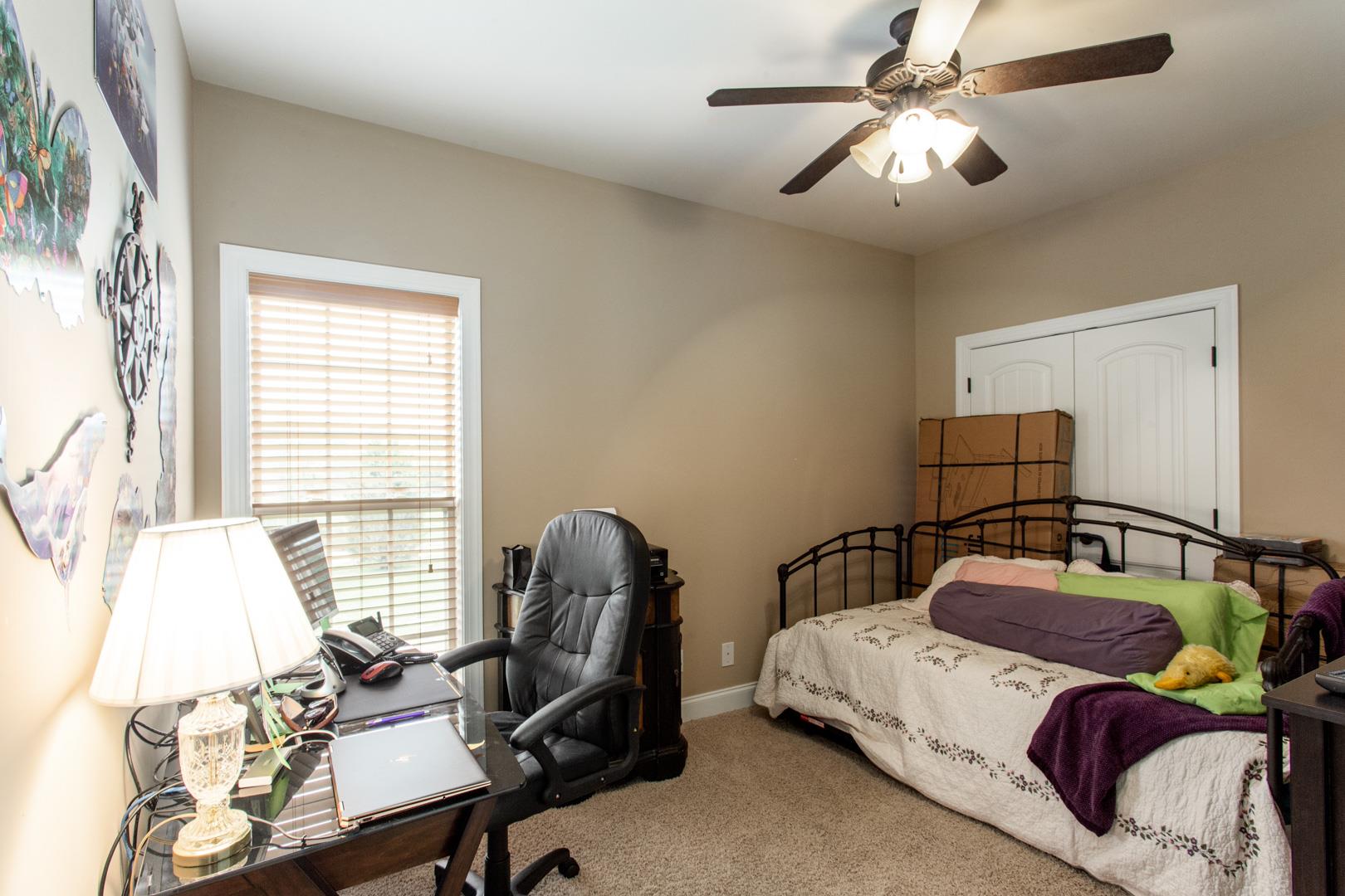 245 Dunaway Road Lebanon, TN 37090 - Photo 20 of 30 a bedroom with a bed and a chandelier