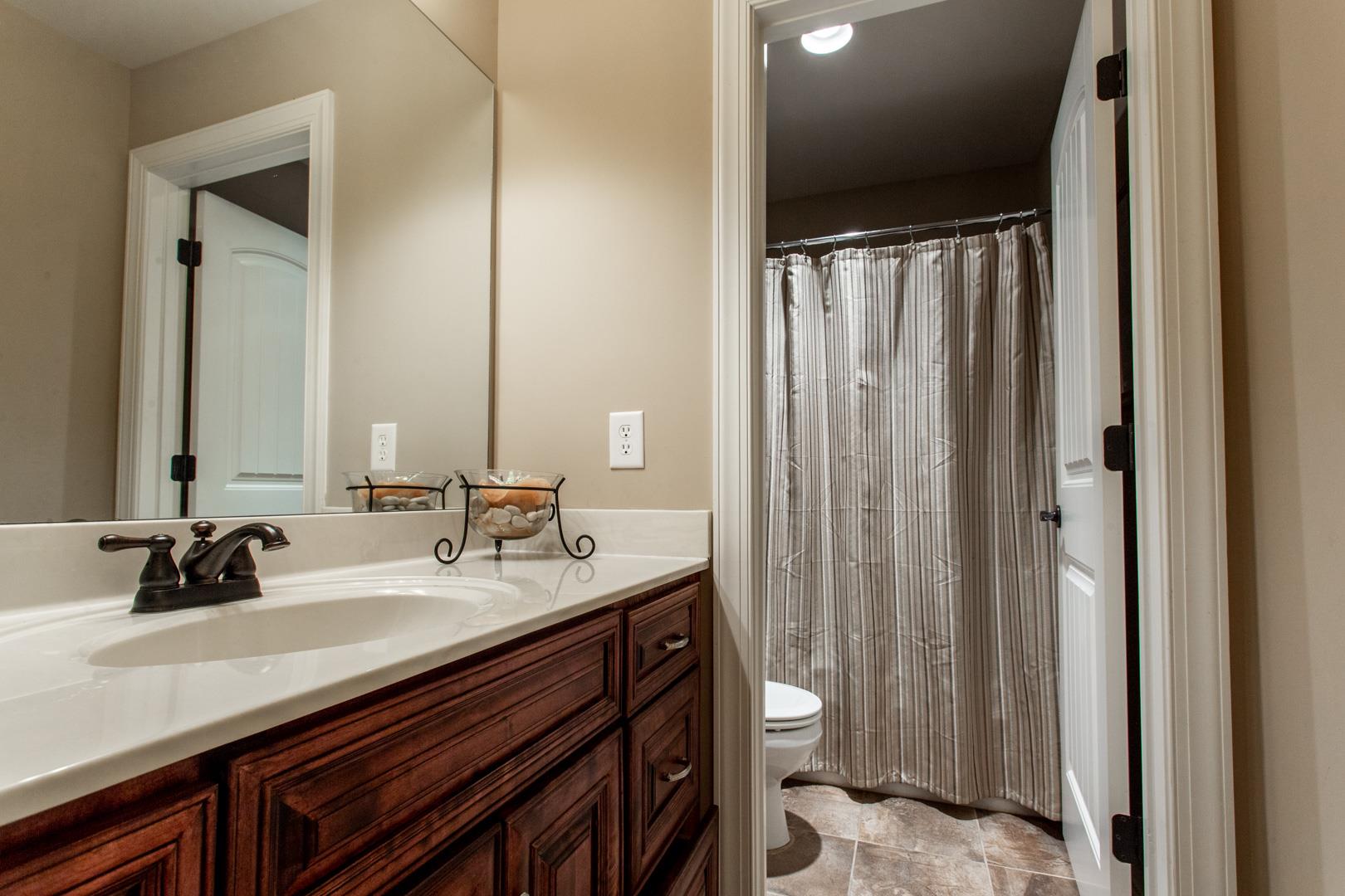 245 Dunaway Road Lebanon, TN 37090 - Photo 23 of 30 a bathroom with a double vanity sink and a mirror