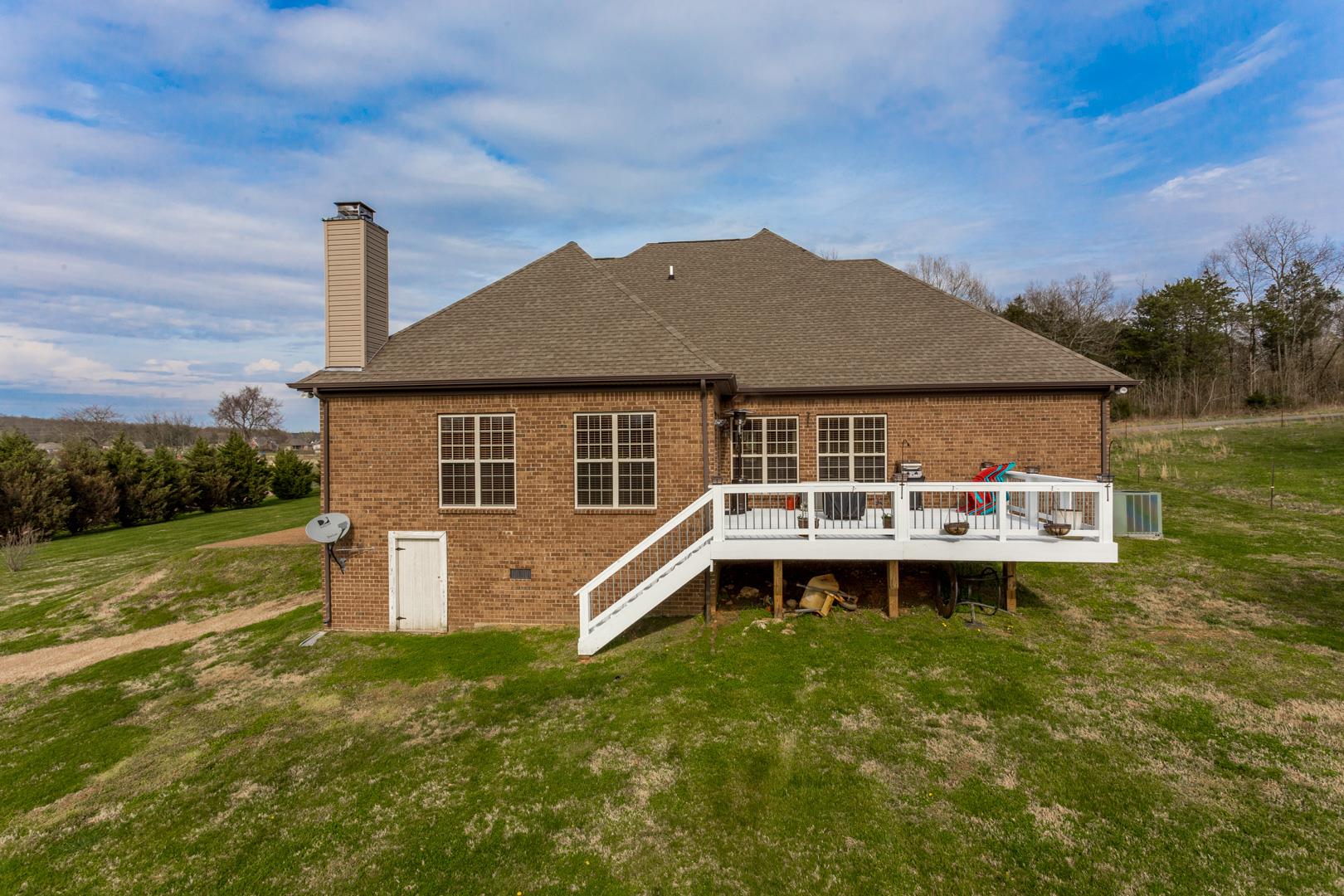 245 Dunaway Road Lebanon, TN 37090 - Photo 29 of 30 a front view of a house with a garden and yard
