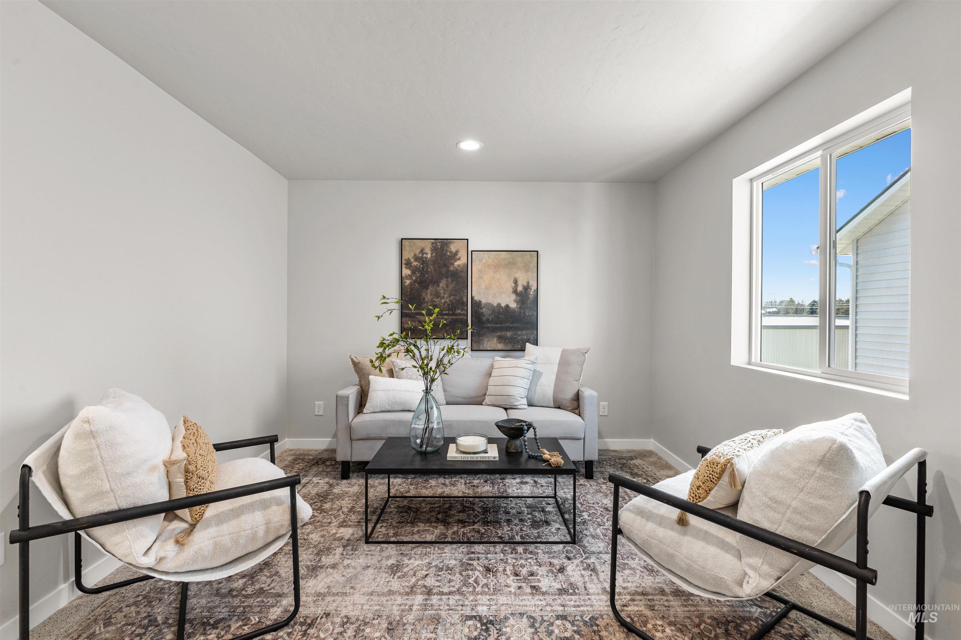 2534 West Fallon Loop Nampa, ID 83651 - Photo 18 of 28 Living room with baseboards and recessed lighting
