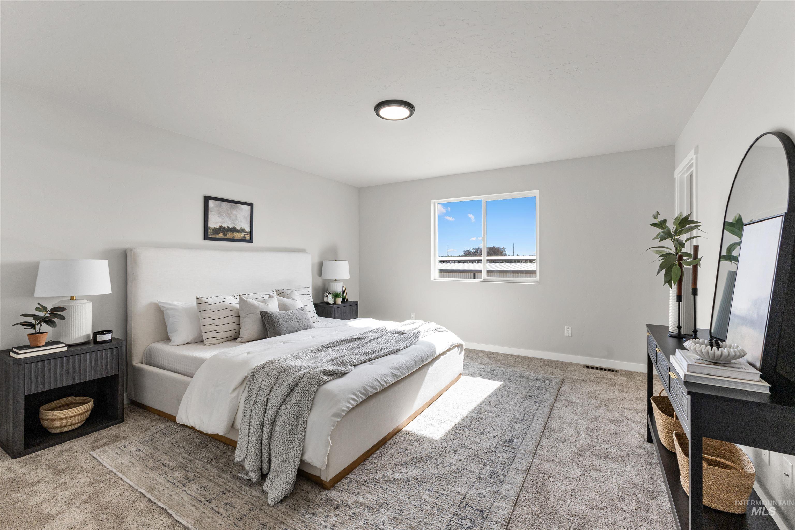 2534 West Fallon Loop Nampa, ID 83651 - Photo 23 of 28 Bedroom with light carpet and baseboards