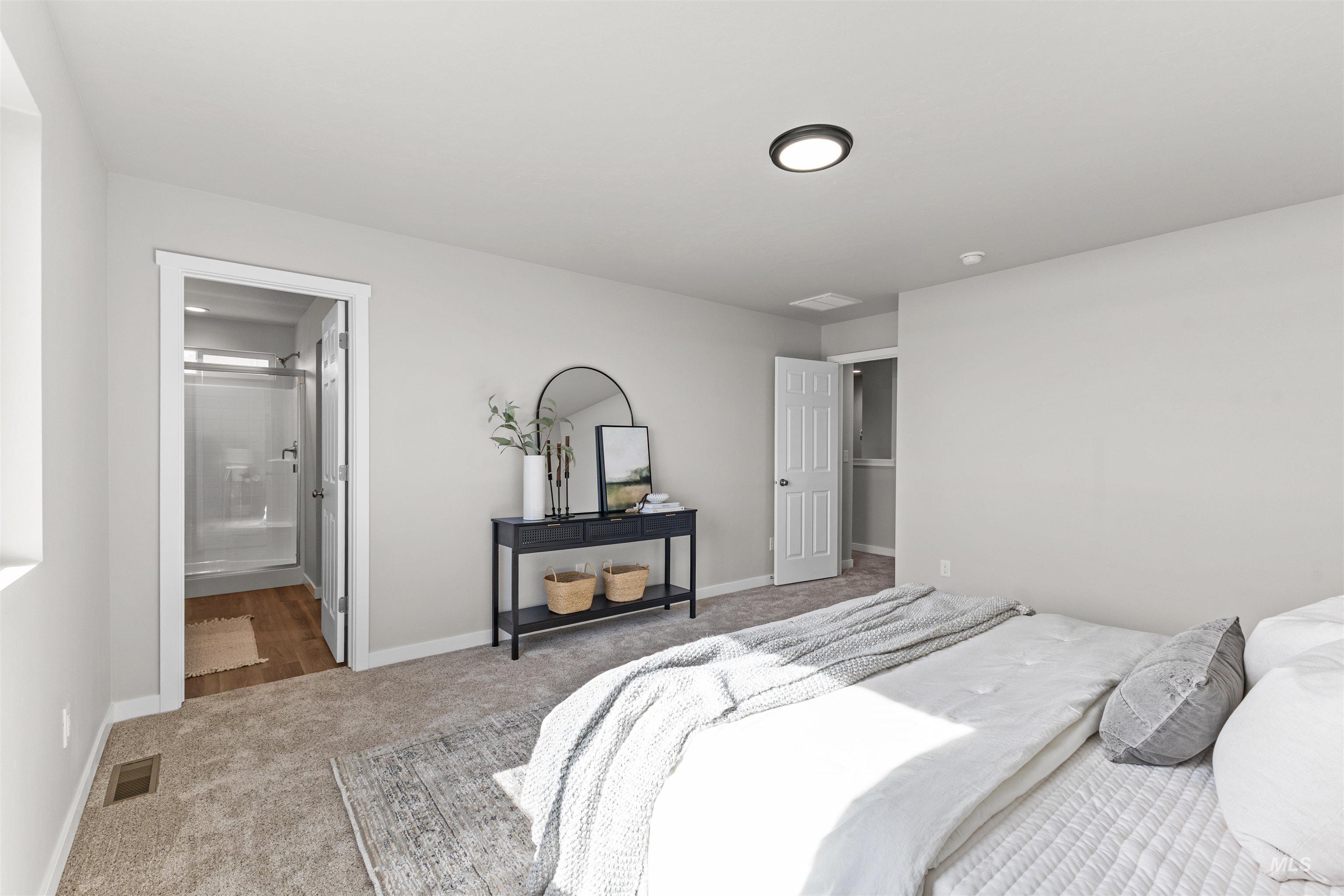 2534 West Fallon Loop Nampa, ID 83651 - Photo 24 of 28 Carpeted bedroom featuring ensuite bath and baseboards
