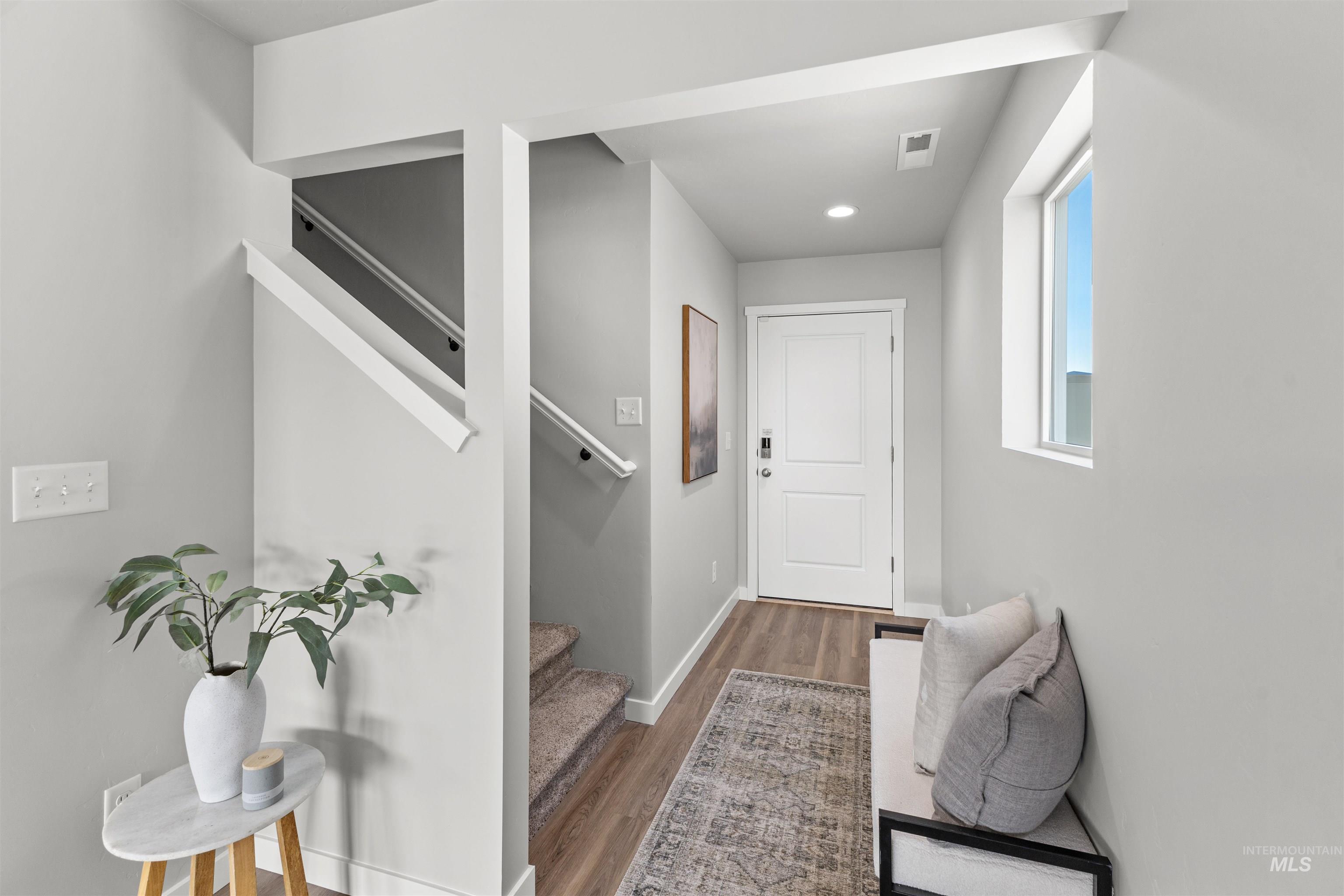 2534 West Fallon Loop Nampa, ID 83651 - Photo 3 of 28 Doorway to outside with wood finished floors and recessed lighting