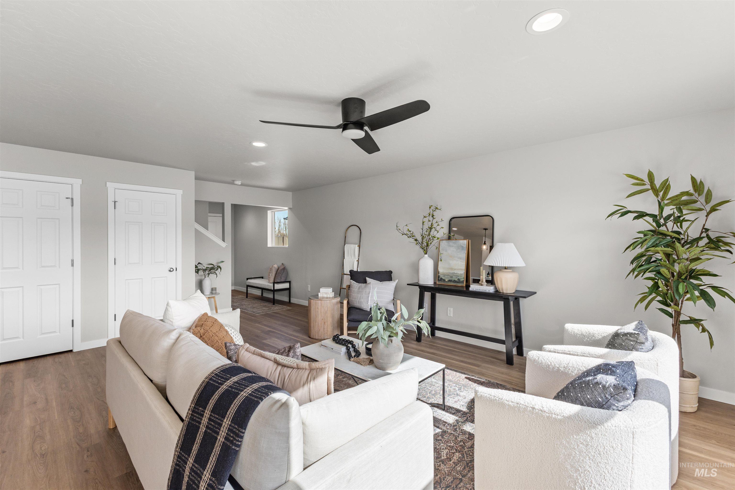 2534 West Fallon Loop Nampa, ID 83651 - Photo 7 of 28 Living area featuring ceiling fan, wood finished floors, and recessed lighting