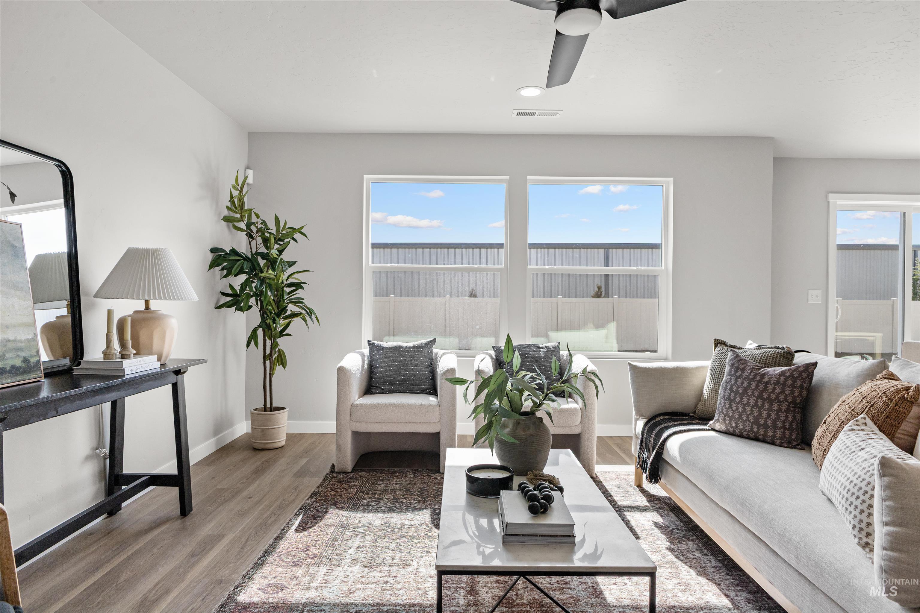 2534 West Fallon Loop Nampa, ID 83651 - Photo 8 of 28 Living room with ceiling fan, wood finished floors, and recessed lighting