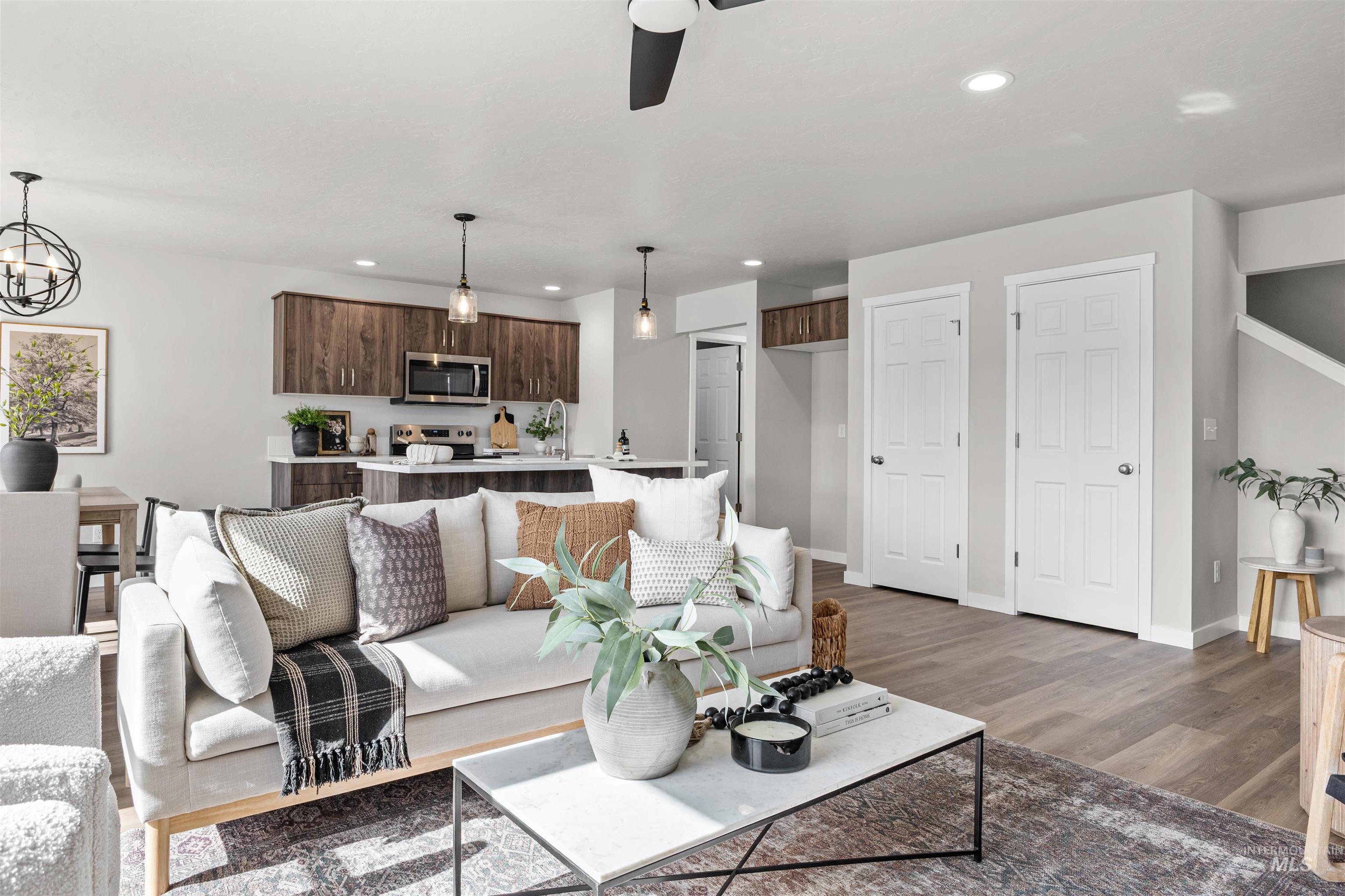 2534 West Fallon Loop Nampa, ID 83651 - Photo 9 of 28 Living room featuring a ceiling fan, dark wood finished floors, and recessed lighting