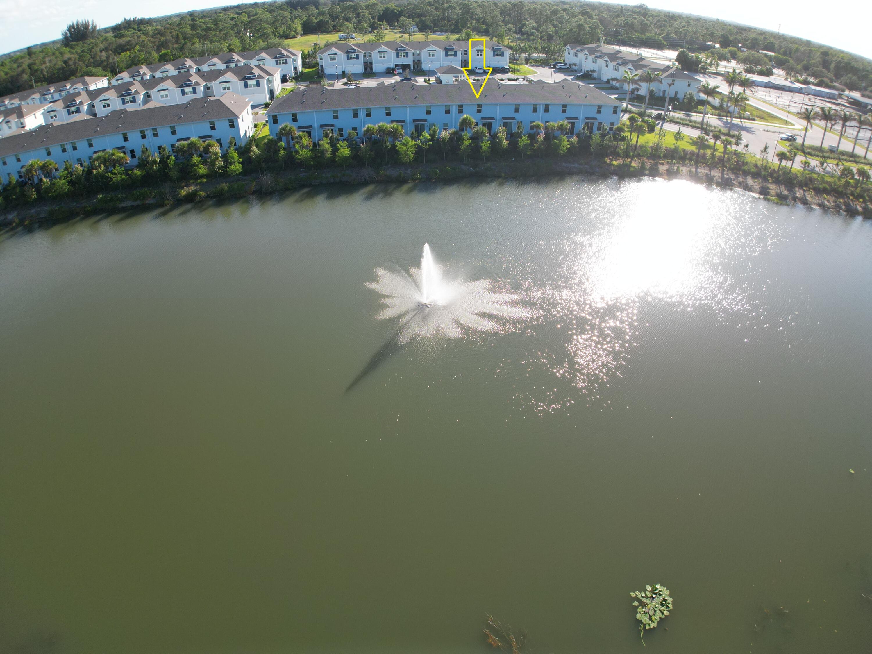 5784 Southeast Edgewater Circle Stuart, FL 34997 - Photo 25 of 33 a view of a lake with a city