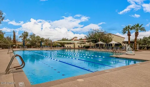 a view of a swimming pool with a lounge chair