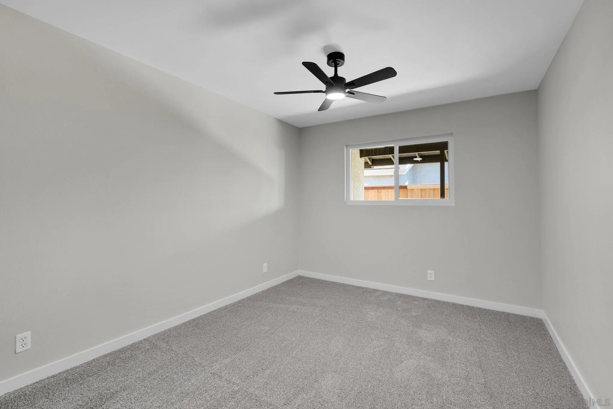 13322 Via Mark Poway, CA 92064 - Photo 16 of 25 an empty room with a window and a fan
