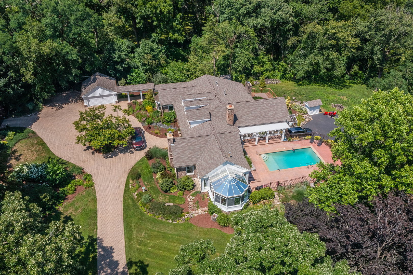 an aerial view of house with yard swimming pool and outdoor seating