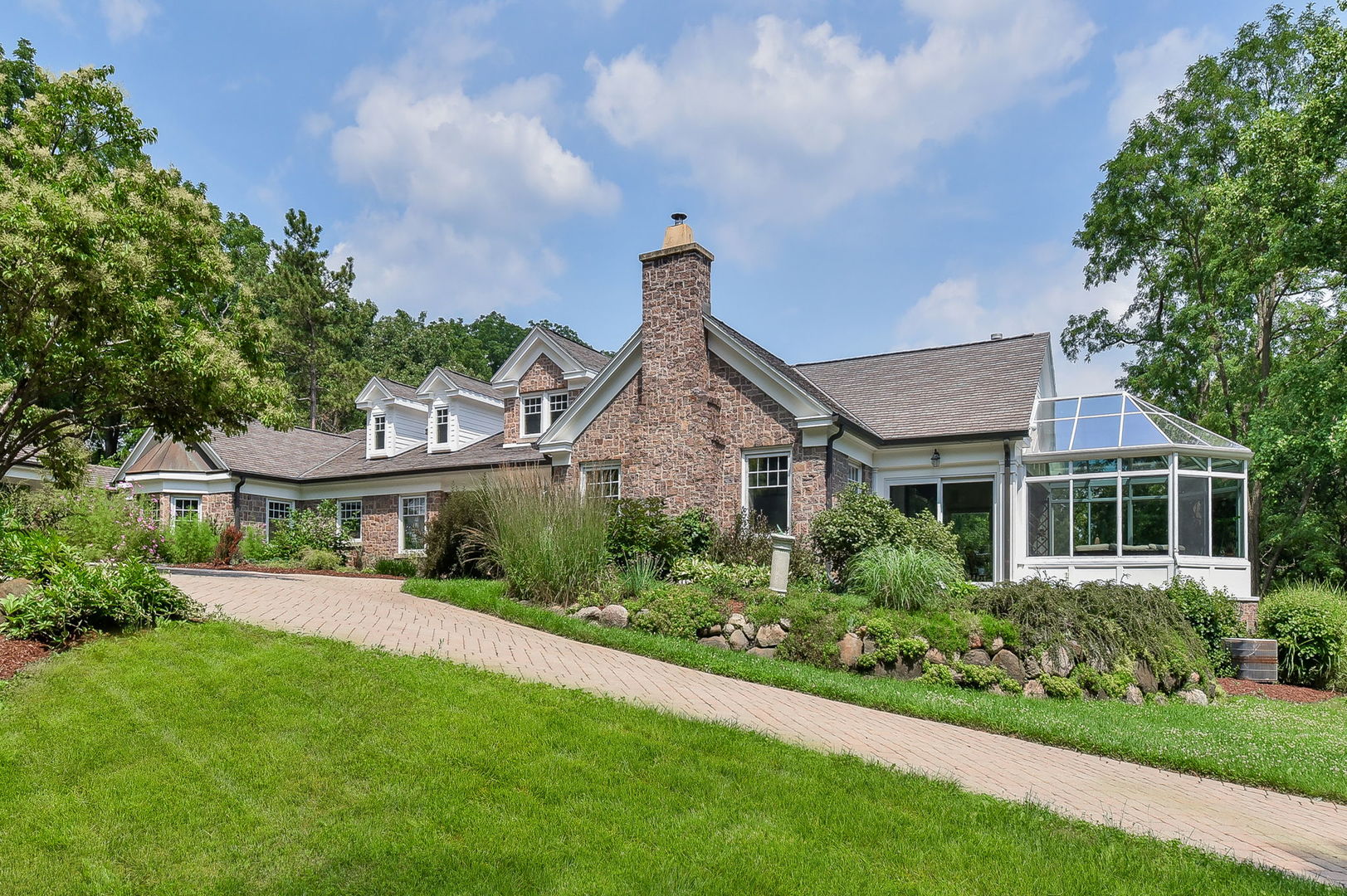 6N197 Denker Road St. Charles, IL 60175 - Photo 12 of 73 a front view of a house with a yard and potted plants