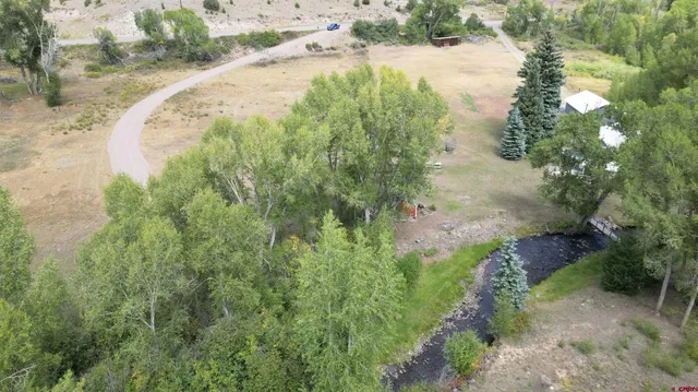 a view of a water pond with green space