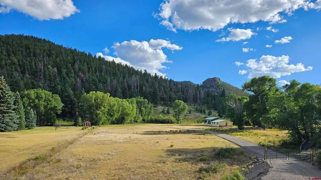 a view of a swimming pool with an outdoor space and seating area