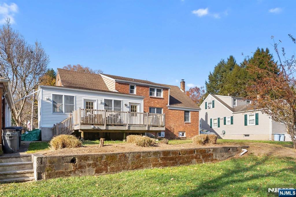 47-49 Fairview Avenue, Unit A Closter, NJ 07624 - Photo 16 of 19 a front view of a house with a yard