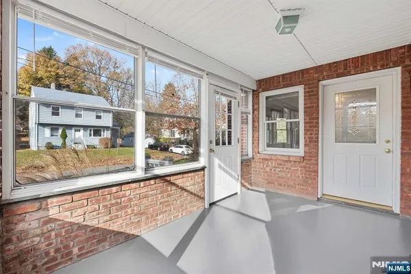 view of an entryway with wooden floor and door