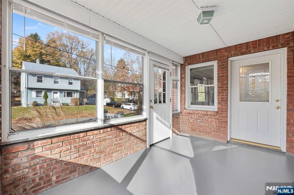 47-49 Fairview Avenue, Unit A Closter, NJ 07624 - Photo 4 of 19 view of an entryway with wooden floor and door