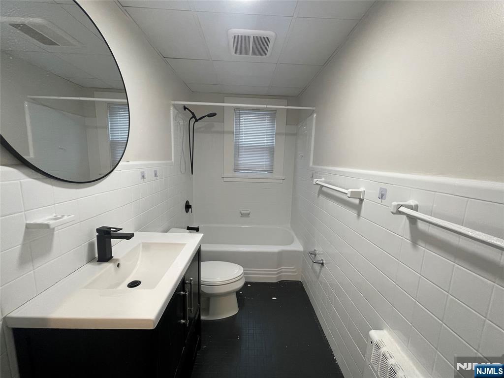 47-49 Fairview Avenue, Unit A Closter, NJ 07624 - Photo 8 of 19 a bathroom with a sink a toilet and a mirror