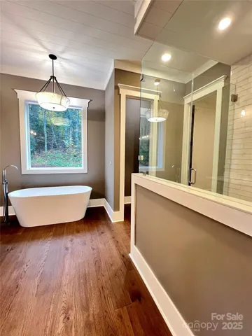 a bathroom with a toilet a sink and a shower