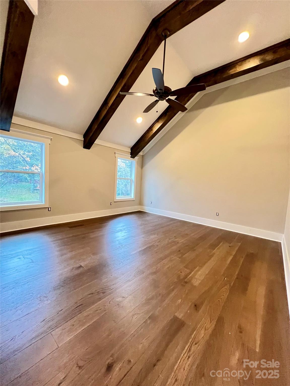 159 Comanche Road Cullowhee, NC 28723 - Photo 25 of 34 a view of an empty room with wooden floor and windows