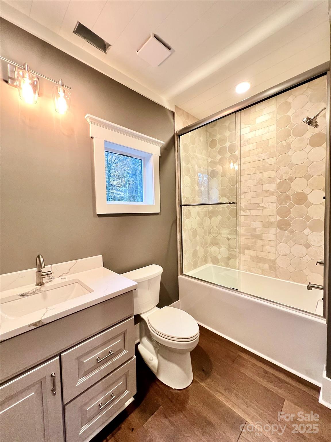 159 Comanche Road Cullowhee, NC 28723 - Photo 28 of 34 a bathroom with a sink a toilet and a large mirror