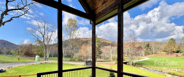 a kitchen with wooden floor and stainless steel appliances
